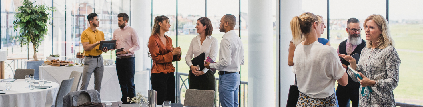 An event venue with attendees networking