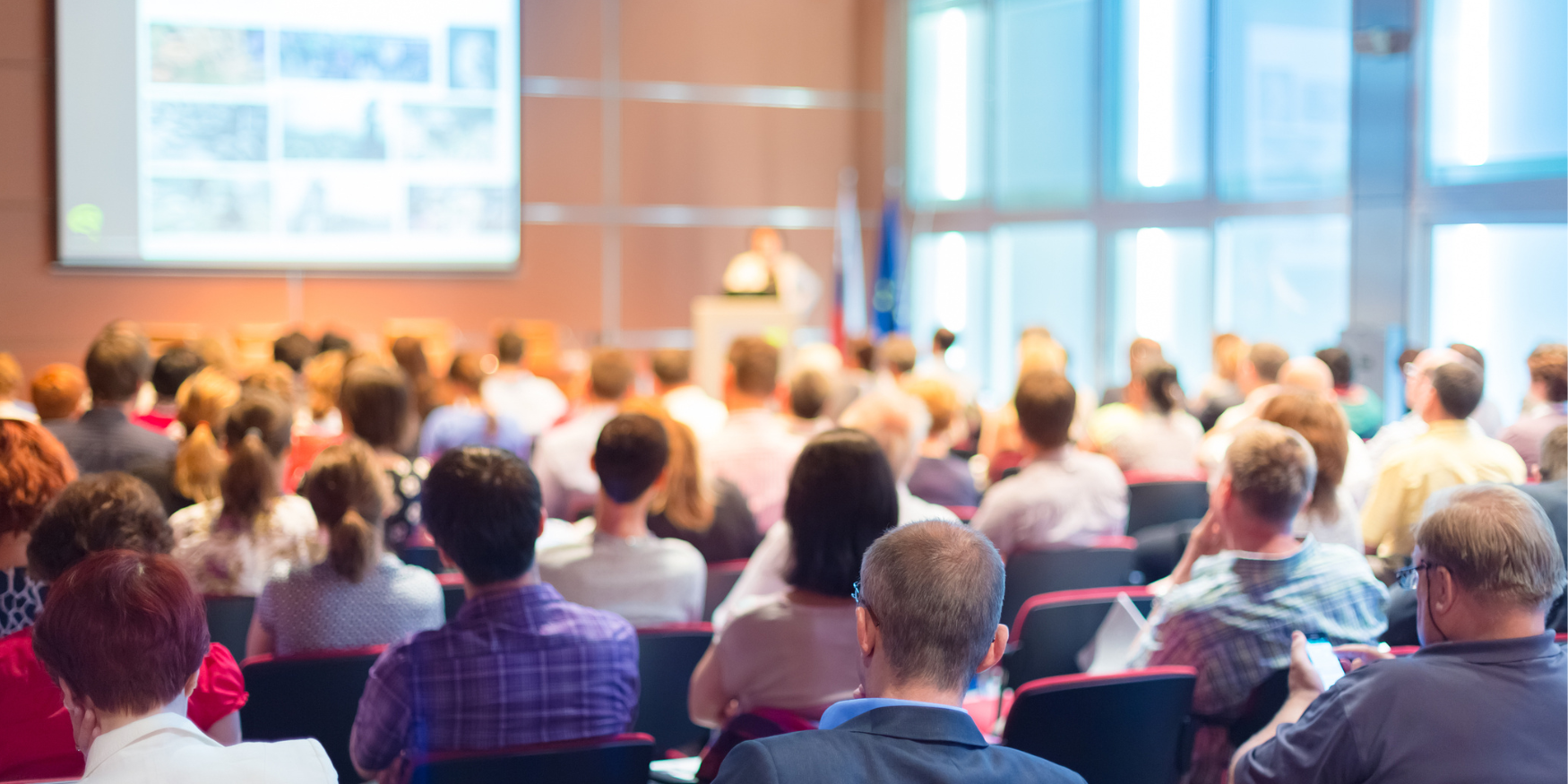 crowd of conference attendees at a presentation