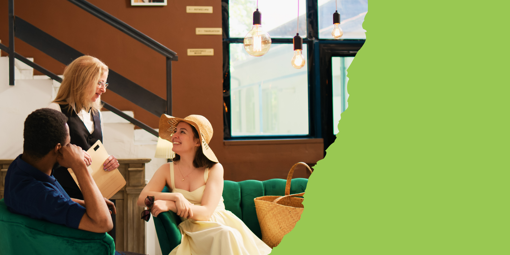 two guests being greeted in hotel lobby by a hotel employee, adding to the guest experience